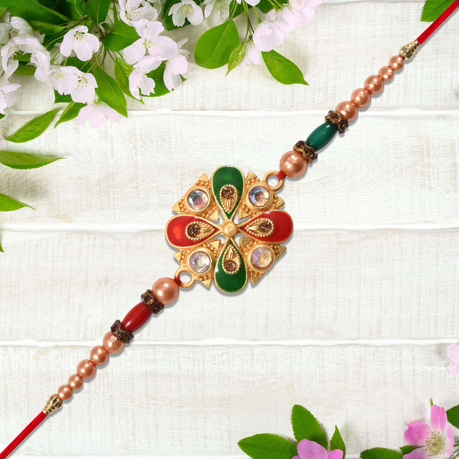 Elegant Meenakari Rakhi With Red-green Enamel  Stones Elegant Meenakari Rakhi With Red-green Enamel  Stones